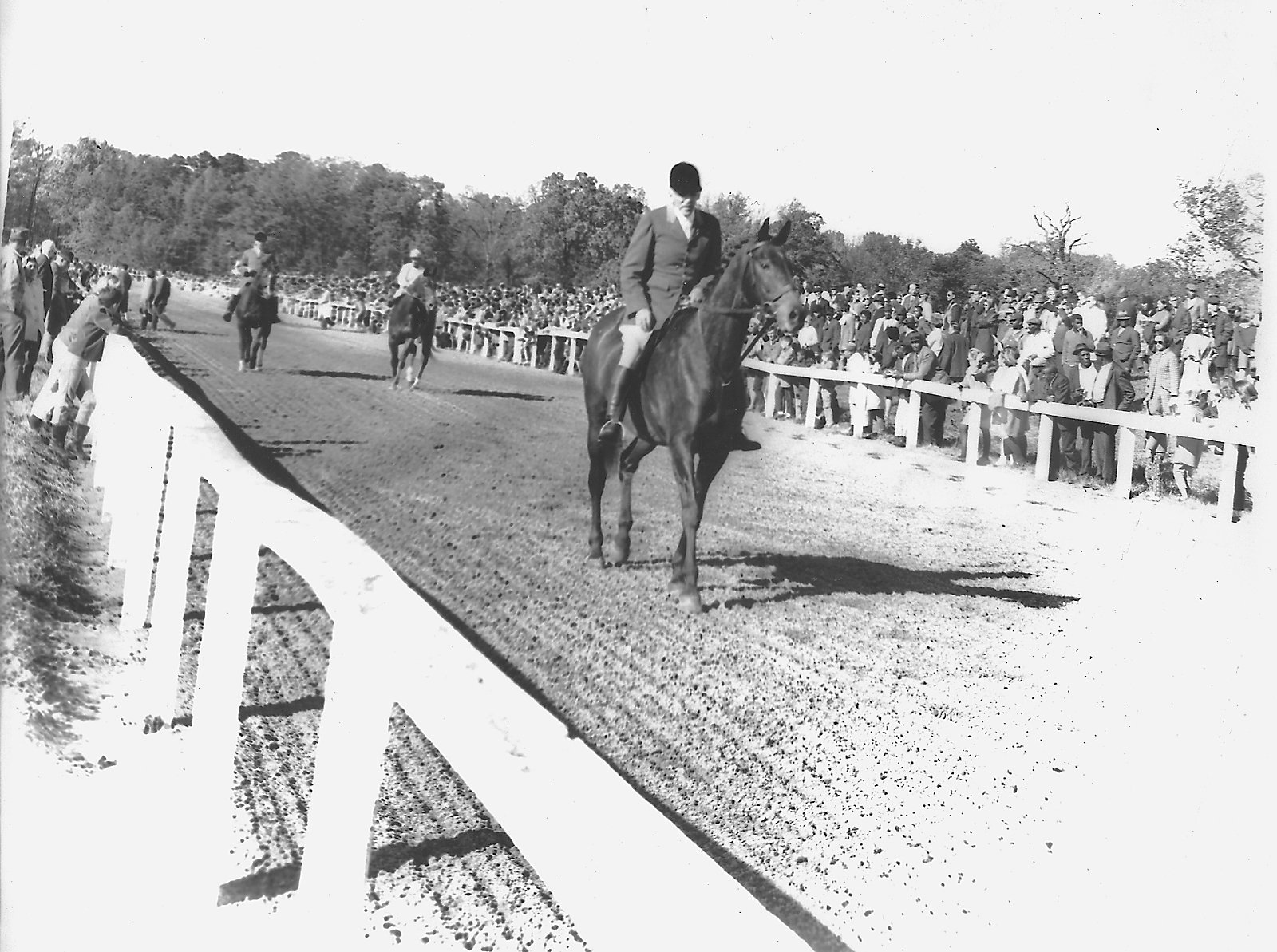   Link Brooking, long time Huntsman for Mrs. Scott,leads horses to the post as an outrider, c. 1960’s  